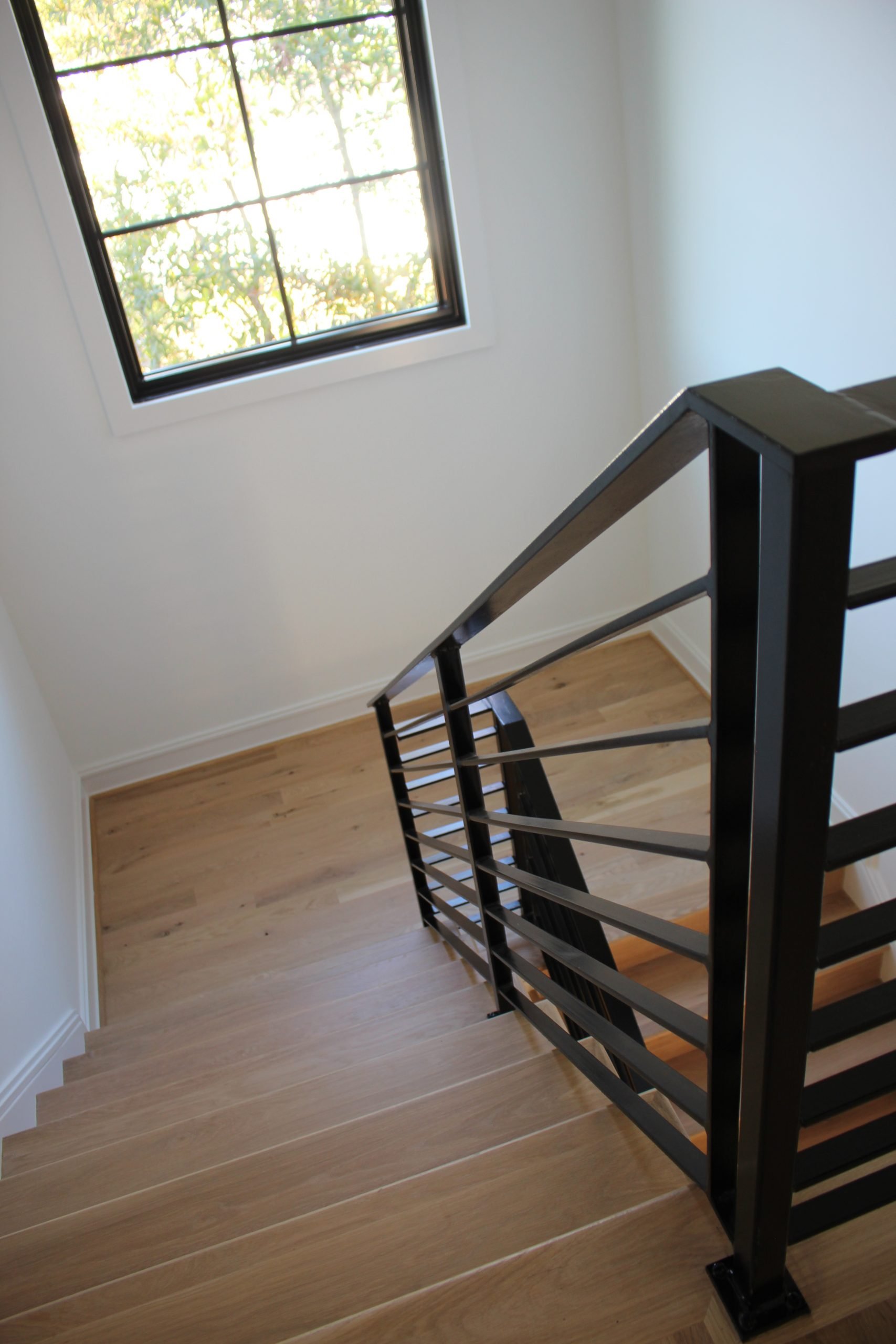 This showcases a completed loudoun stairs project within a home in northern virginia. This showcases the metal fabrication that loudoun stairs did in their shop. 