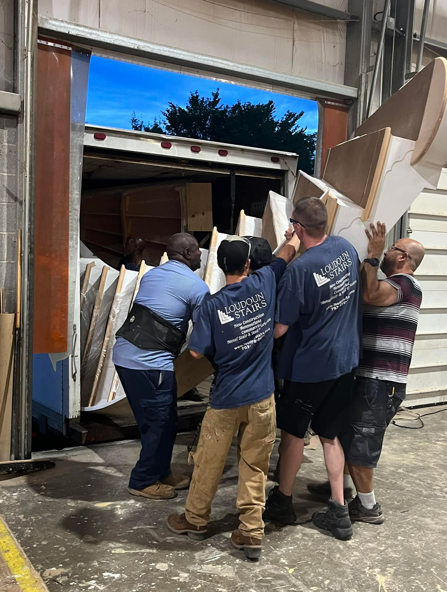 This is the loudoun stairs team loading a staircase into their truck.