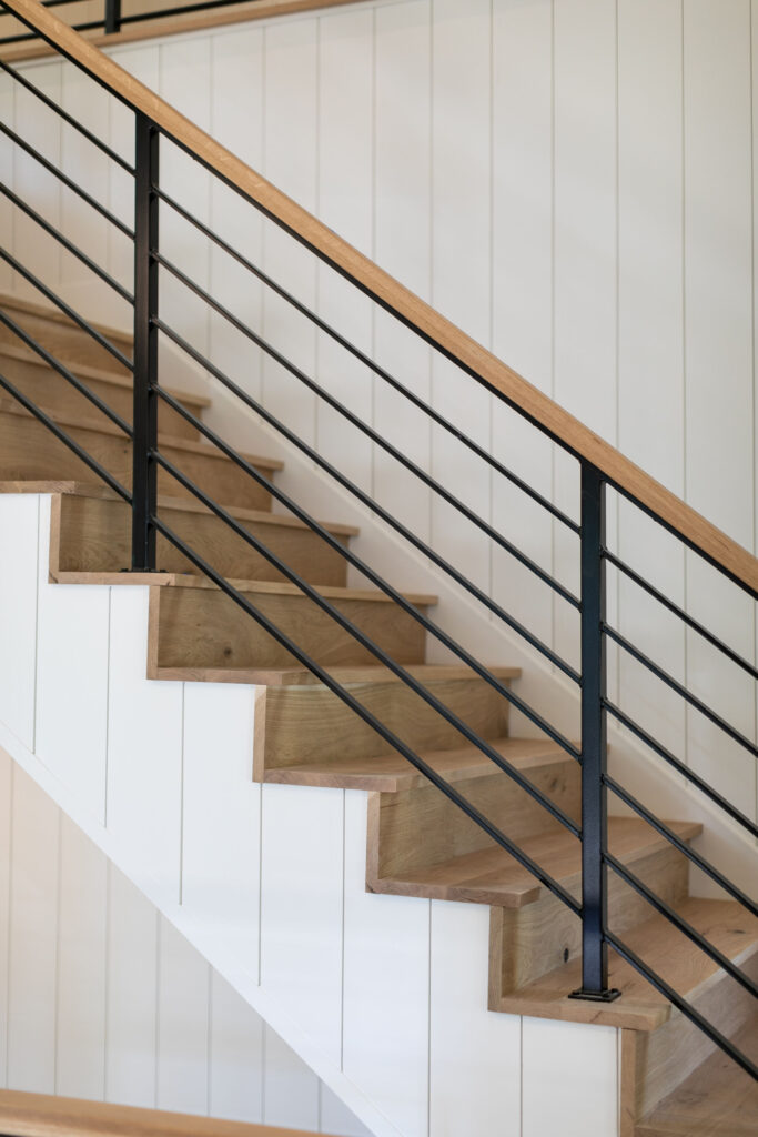 This shows a completed loudoun stairs' stair and rail project in a home.